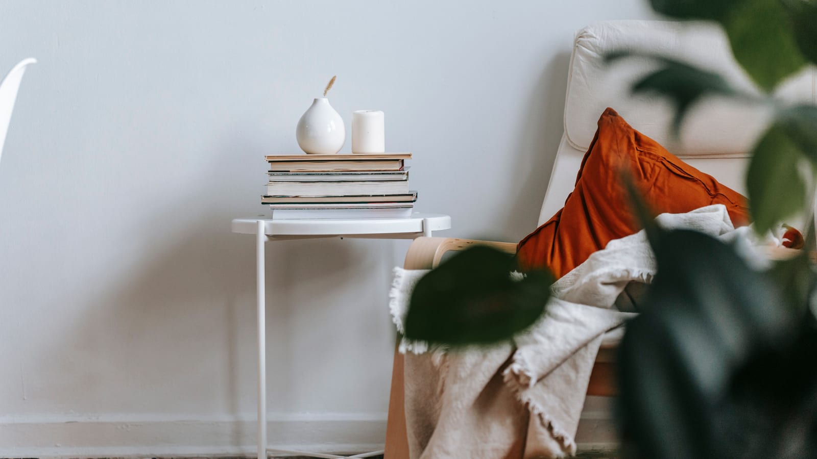 Calm, softly lit sitting area with linen furnishings and a potted plant — managing stress during weight loss at OC Weight