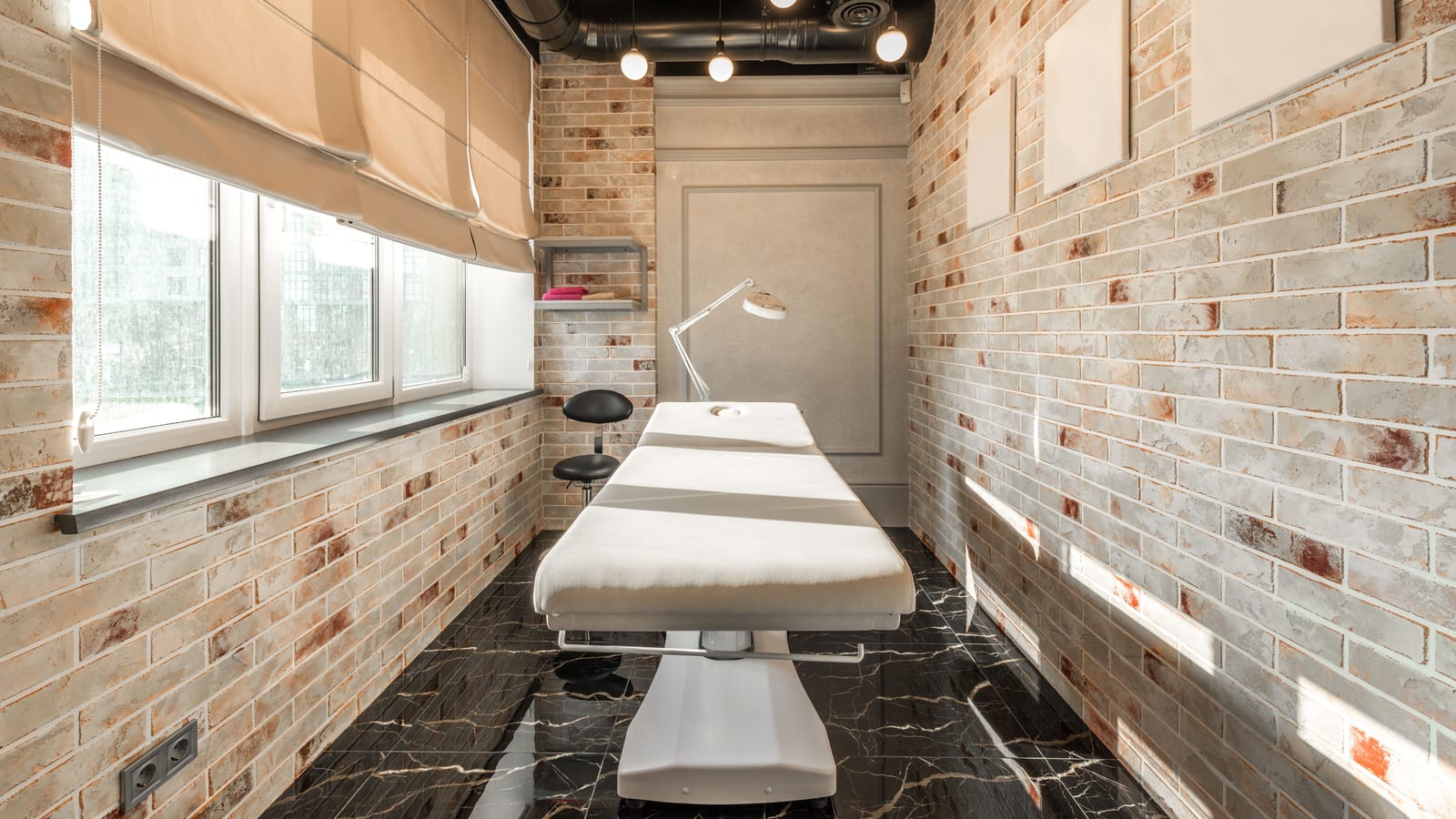 Serene med spa treatment room with a linen-draped bed and a large window — why losing excess weight improves your health at