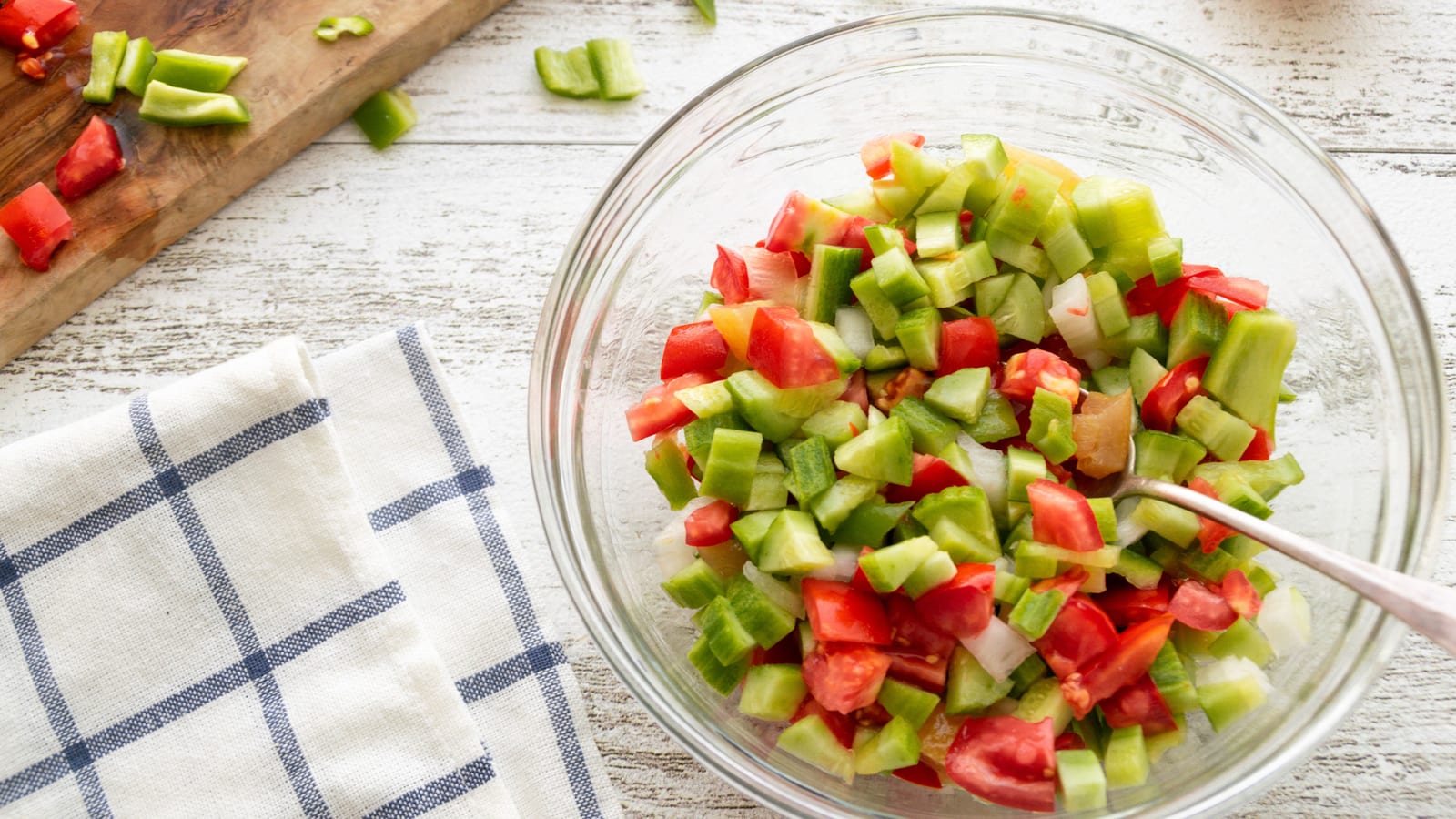 Fresh vegetables and a prepared salad bowl on a wooden table — eating healthy for weight loss at OC Weight Loss & Med Spa