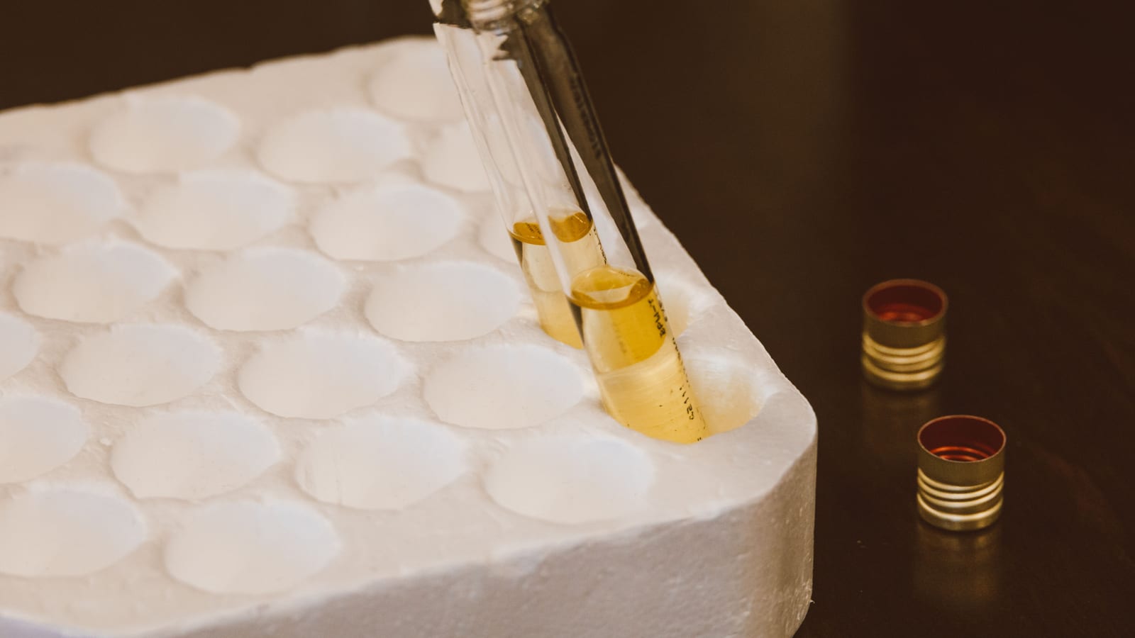 Small glass vials in a tray on a clean counter — best peptides for recovery at OC Weight Loss & Med Spa, Mission Viejo