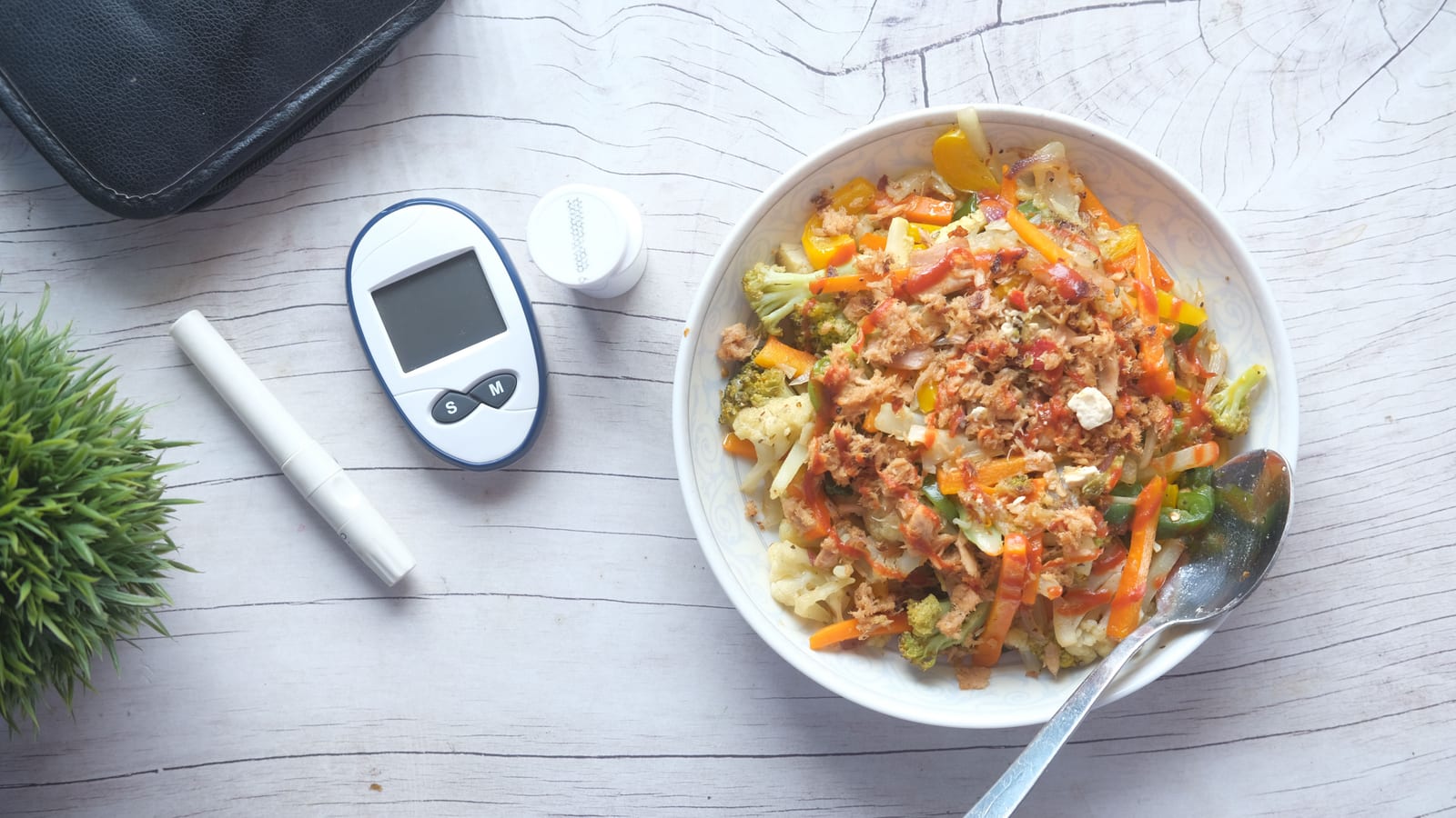 Fresh vegetables and a prepared salad bowl on a wooden table — medical weight loss in mission viejo at OC Weight Loss & Med