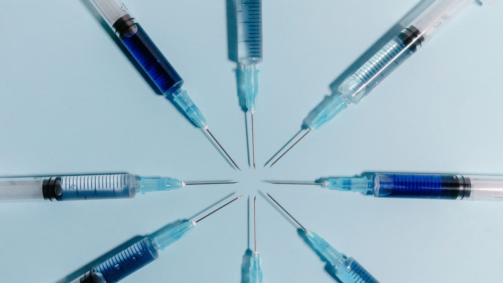 Single-dose injector pen and alcohol swabs on a pale surface — compounded tirzepatide vs brand at OC Weight Loss & Med Spa