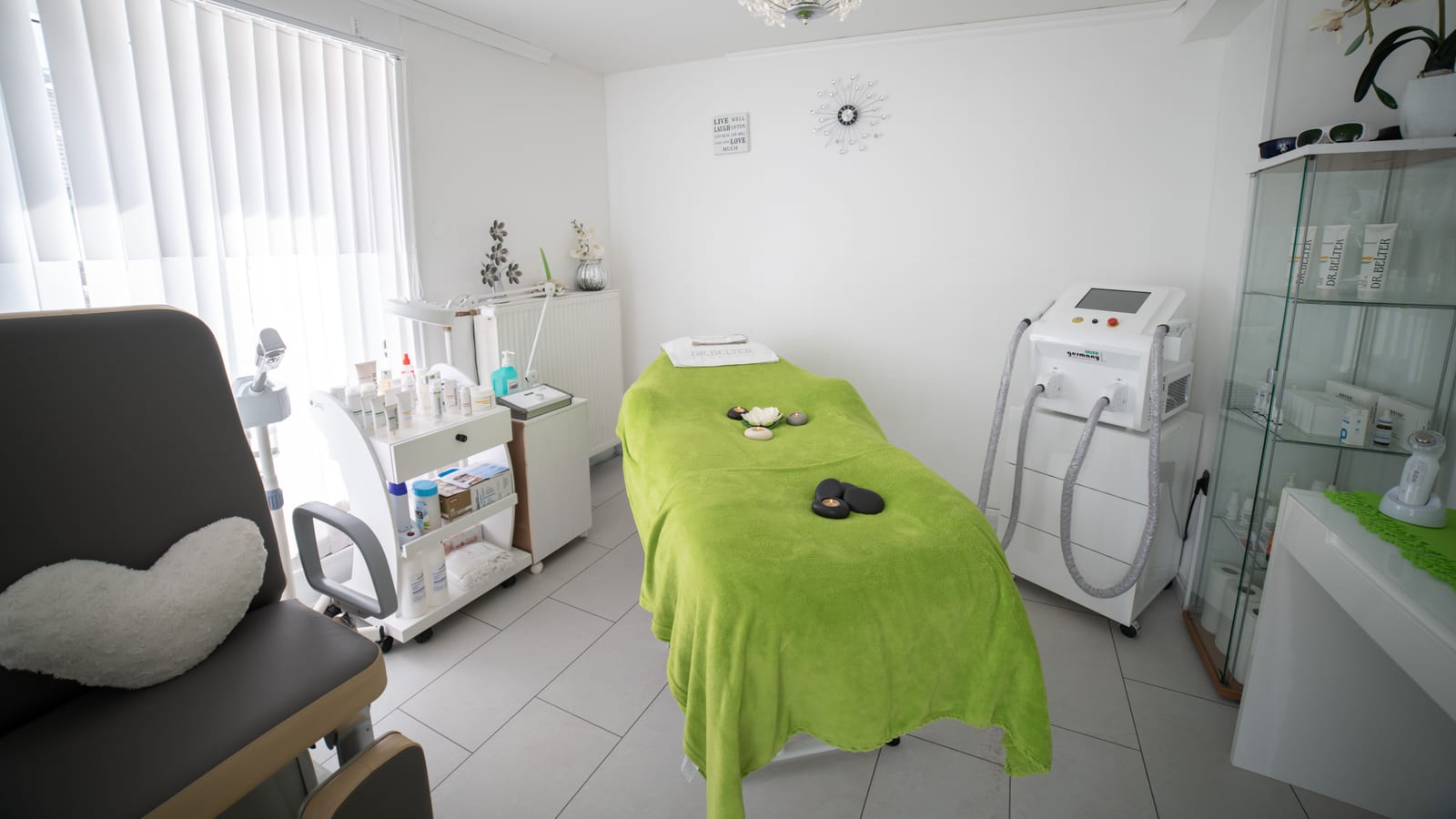 Body-contouring equipment beside a treatment bed in a clinic room — coolsculpting in irvine at OC Weight Loss & Med Spa