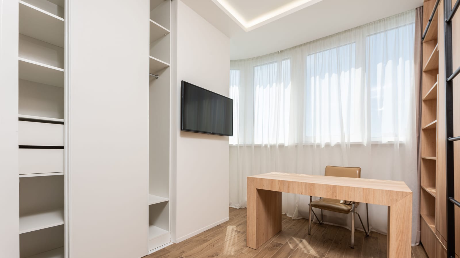 Clinician’s consultation room with a desk and window light — testosterone decline & hormone replacement therapy at OC Weight