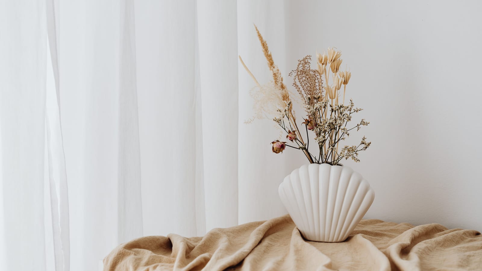 Calm, softly lit sitting area with linen furnishings and a potted plant — does losing weight improve your mental health at