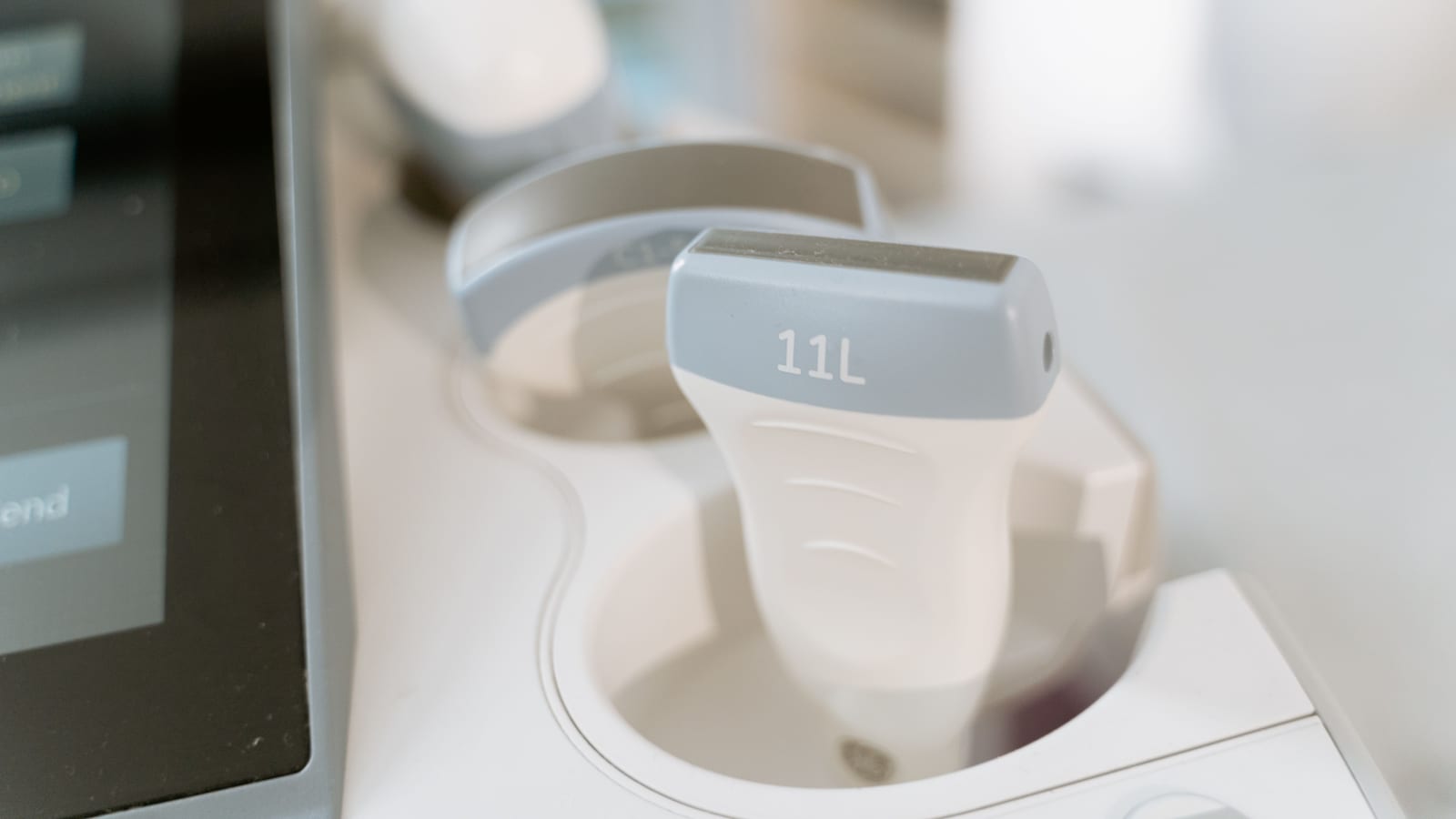 Body-contouring equipment beside a treatment bed in a clinic room — coolsculpting at OC Weight Loss & Med Spa, Mission Viejo