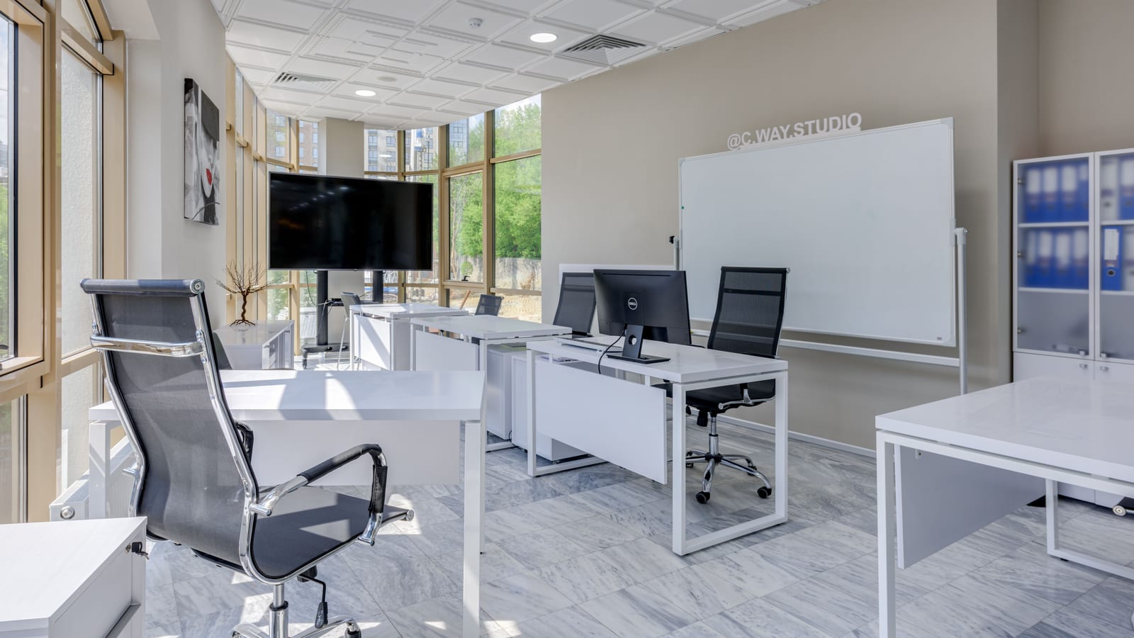 Clinician’s consultation room with a desk and window light — hrt in newport beach at OC Weight Loss & Med Spa, Mission Viejo