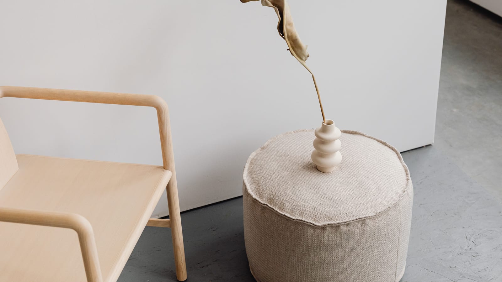 Calm, softly lit sitting area with linen furnishings and a potted plant — how stress causes weight gain at OC Weight Loss &