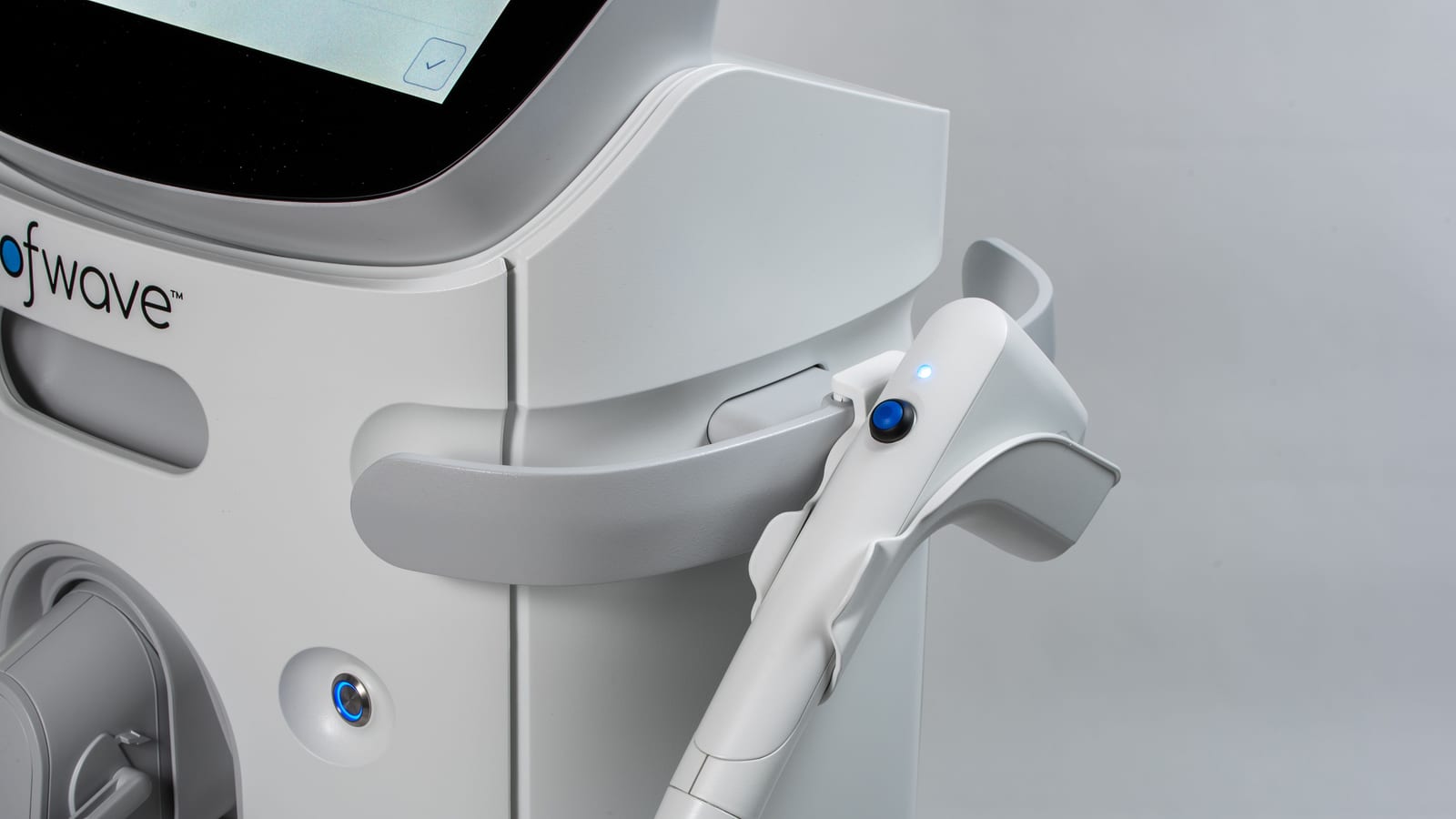 Laser handpiece and console in a treatment room — laser hair removal in newport beach at OC Weight Loss & Med Spa, Mission