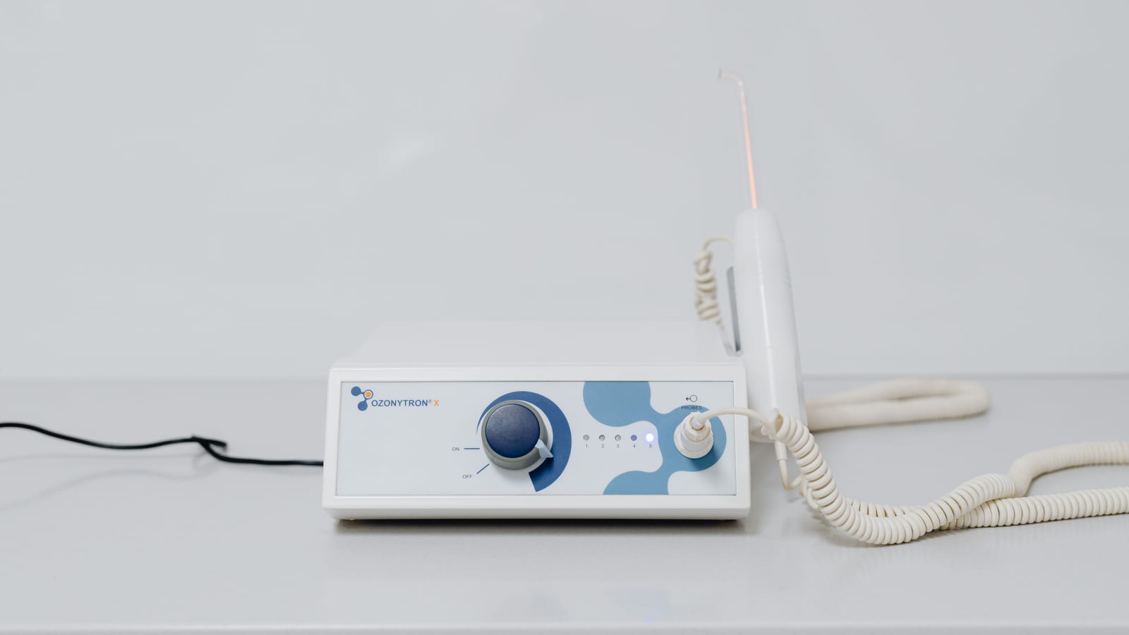 Laser handpiece and console in a treatment room — laser hair removal in irvine at OC Weight Loss & Med Spa, Mission Viejo