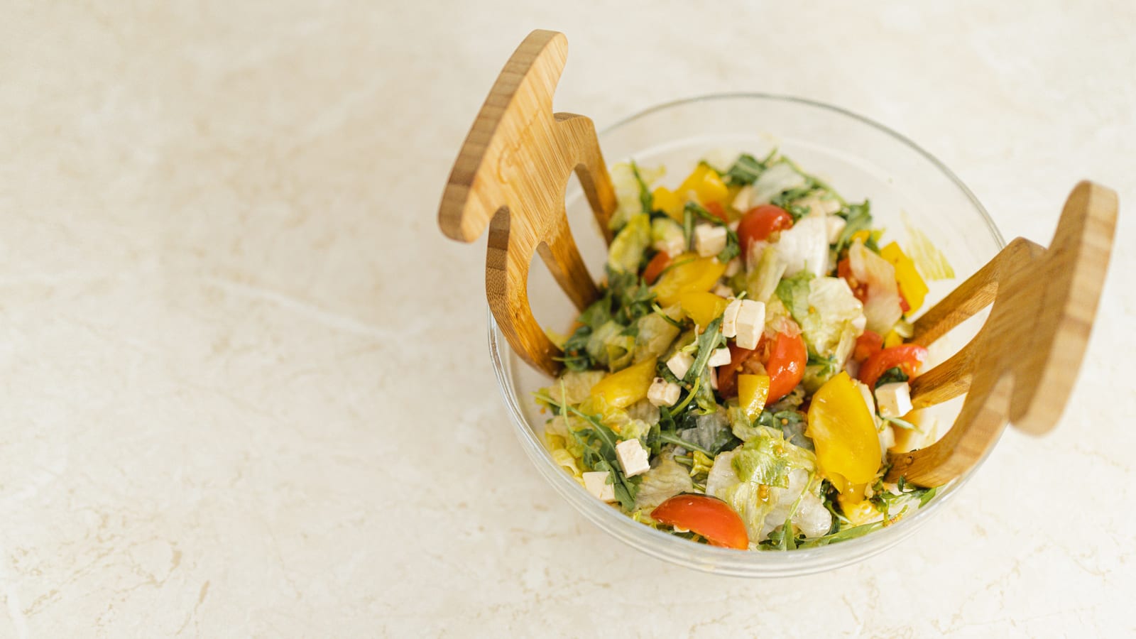 Fresh vegetables and a prepared salad bowl on a wooden table — semaglutide with diet and exercise at OC Weight Loss & Med