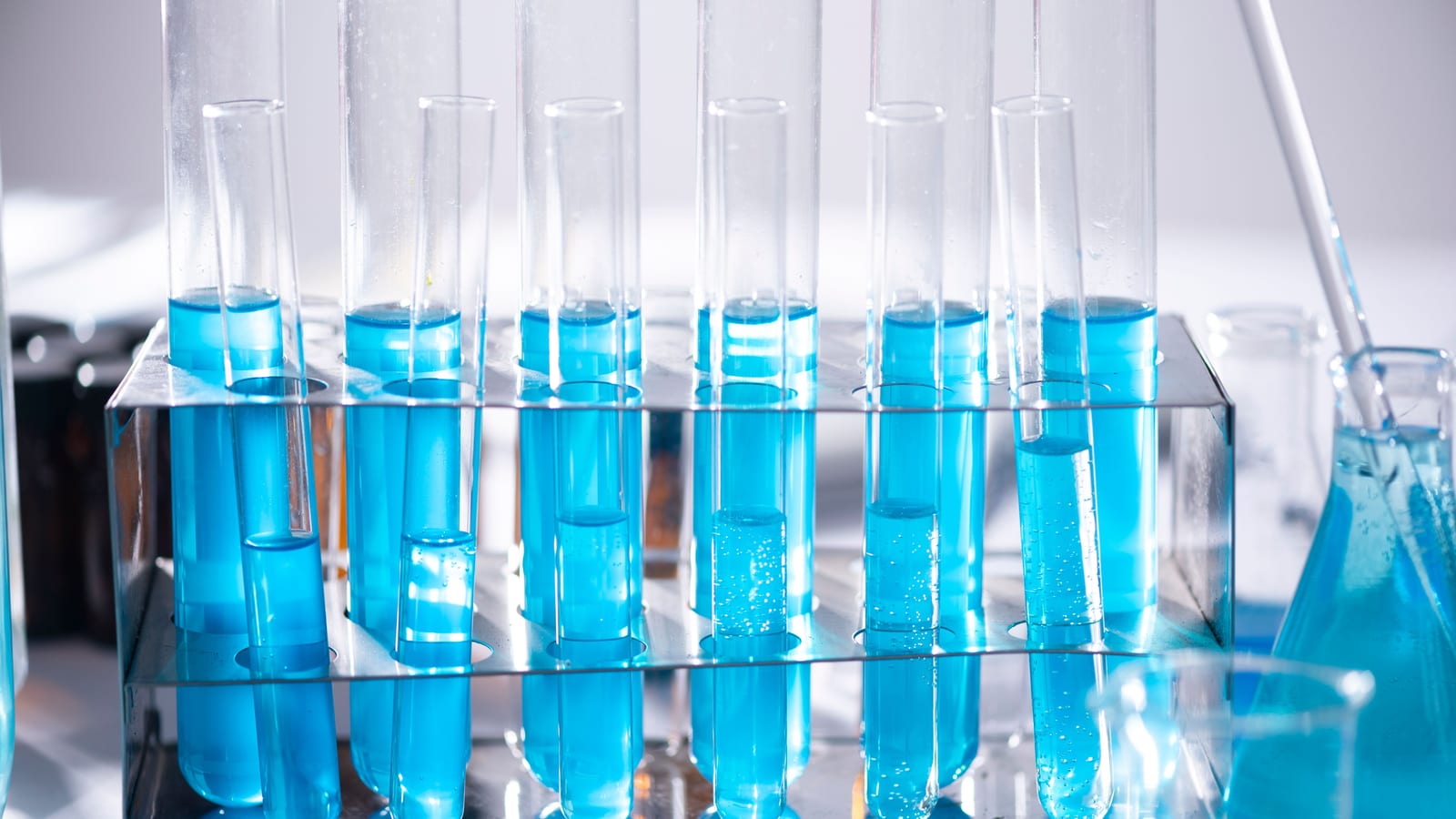 Small glass vials in a tray on a clean counter — peptide therapy in irvine at OC Weight Loss & Med Spa, Mission Viejo