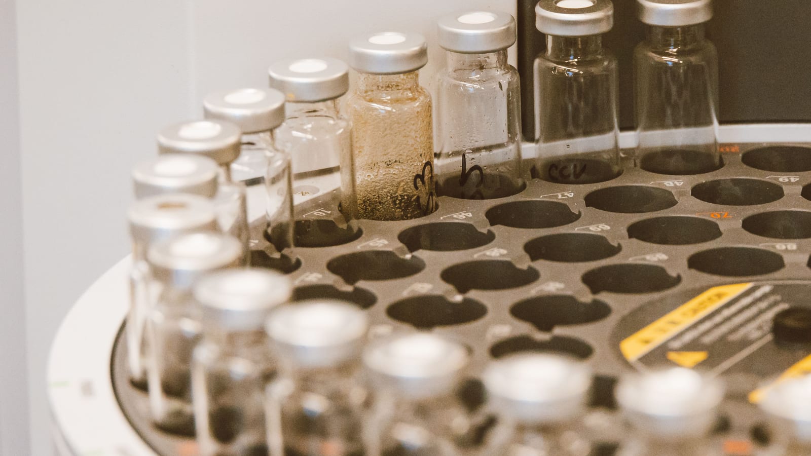 Fine syringe and glass vial on a stainless tray — testosterone pellets vs injections at OC Weight Loss & Med Spa, Mission