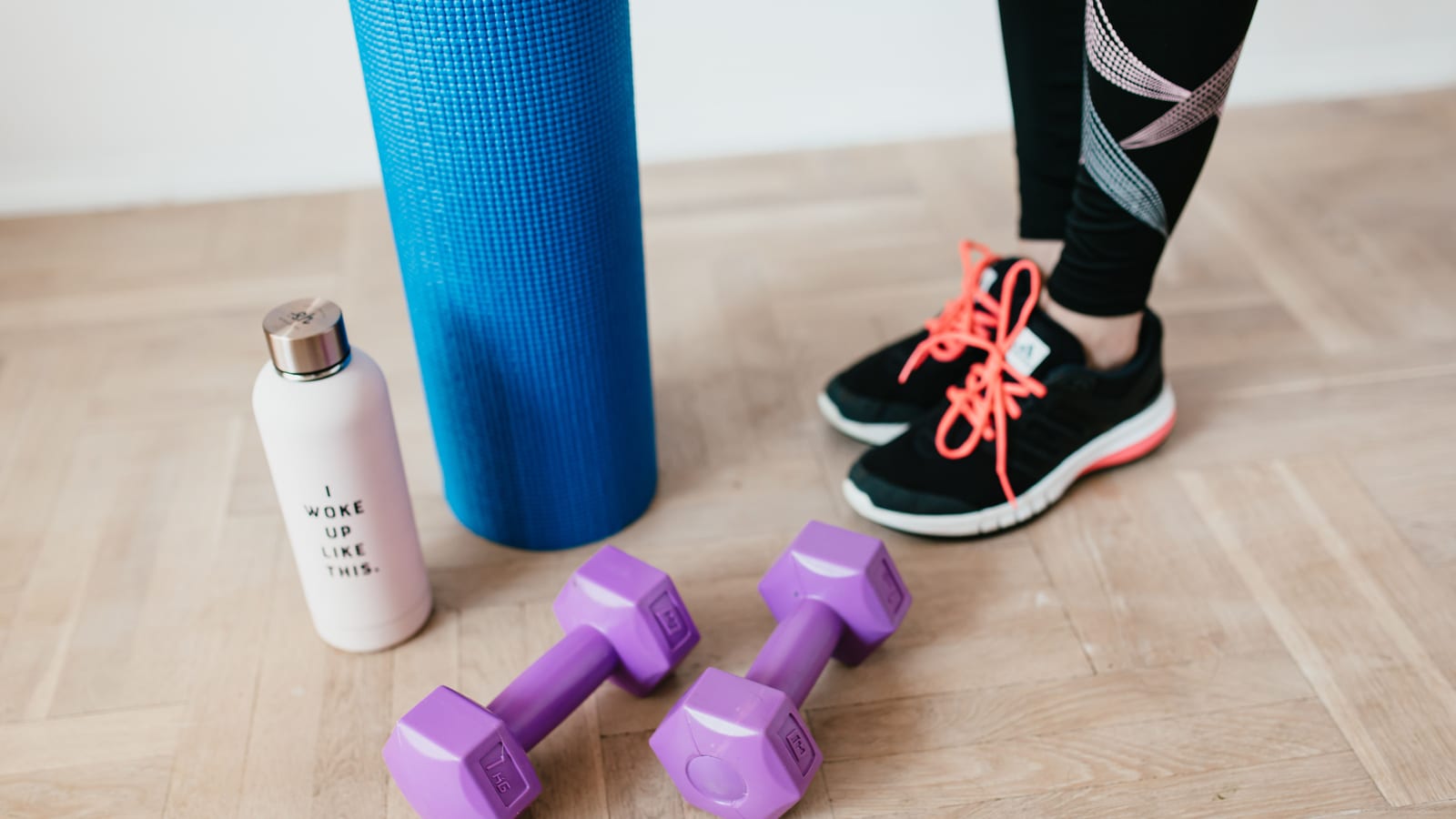 Exercise mat, dumbbell and folded towel in a bright, minimal room — exercise and semaglutide at OC Weight Loss & Med Spa