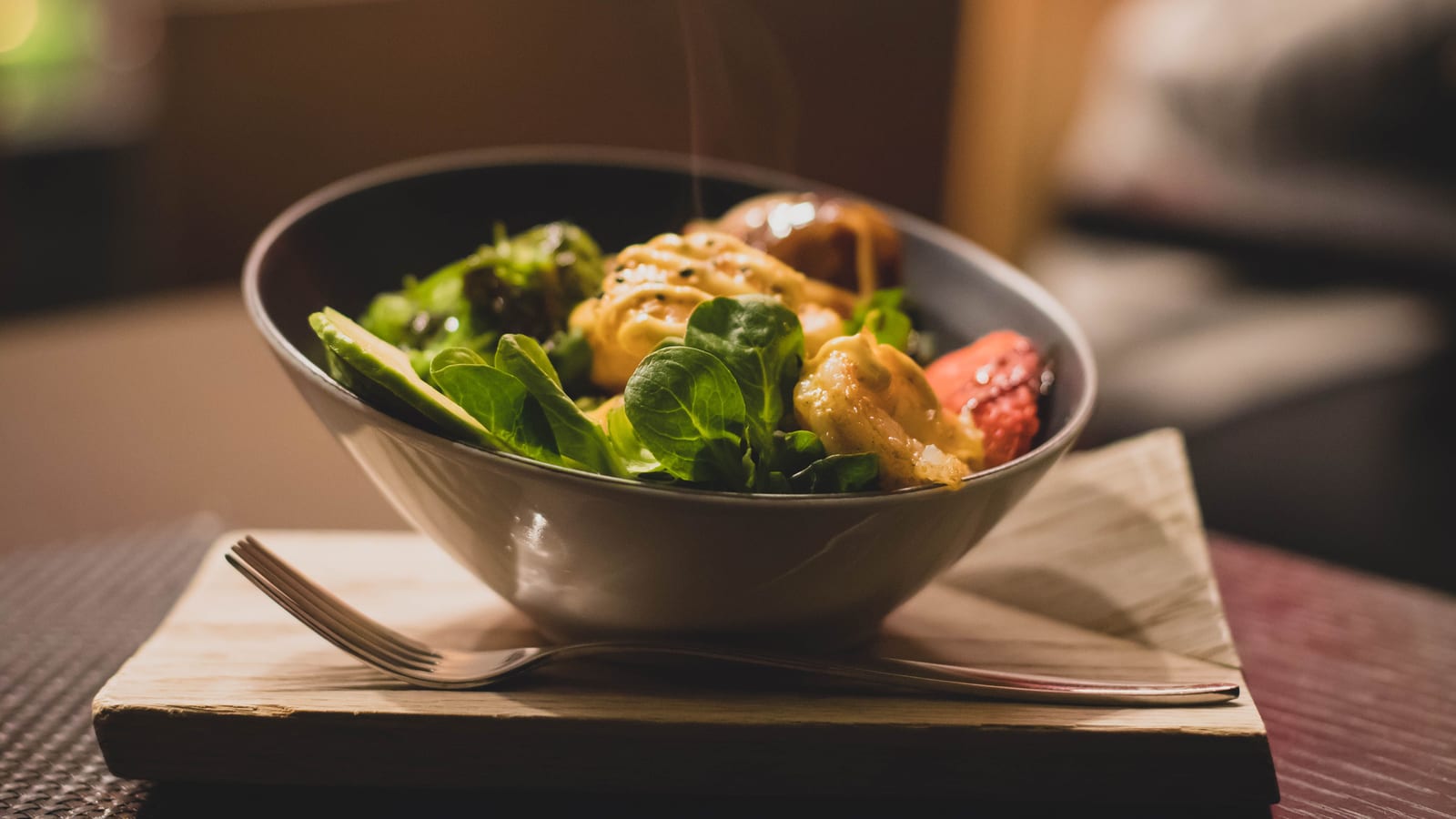Fresh vegetables and a prepared salad bowl on a wooden table — tirzepatide diet plan at OC Weight Loss & Med Spa, Mission