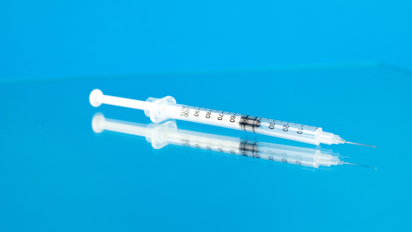 Single-dose injector pen and alcohol swabs on a pale surface — tirzepatide near me in orange county at OC Weight Loss & Med