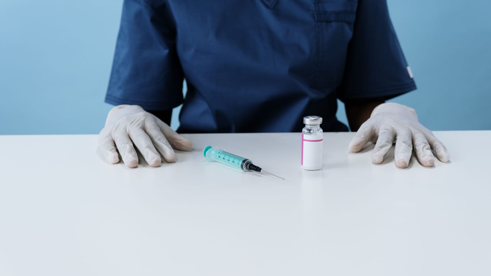 Fine syringe and glass vial on a stainless tray — lipotropic fat-burning injections for weight loss at OC Weight Loss & Med